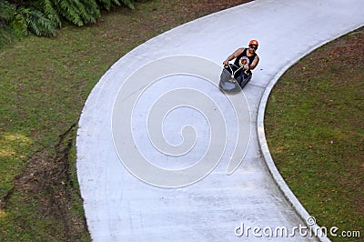 Man ride on Skyline Rotorua Luge Editorial Stock Photo