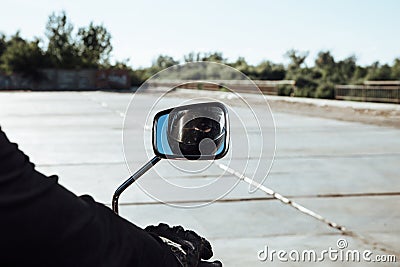 Man rides a motorcycle in the city.Motorcyclist riding a bike during the day on the road Stock Photo