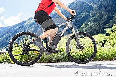 Man Riding Electric Mountain Bike Stock Photo