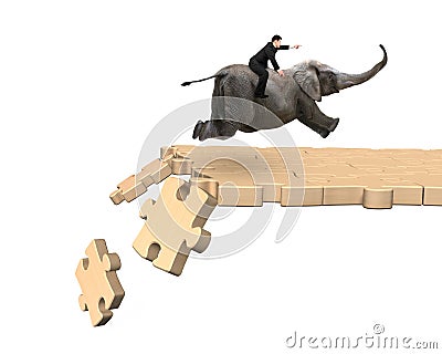 Man riding elephant on breaking puzzle path Stock Photo