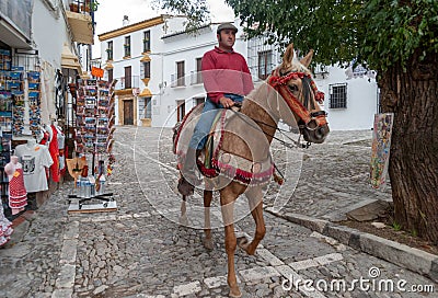 Man riding horse on street of Ronda, Spain Editorial Stock Photo