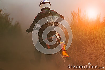 Man riding sport enduro motorcycle on dirt track Stock Photo