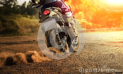 Man riding sport touring motorcycle on dirt field Stock Photo