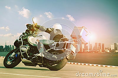 Man riding touring motorcycle on sharp curve for traveling and c Stock Photo