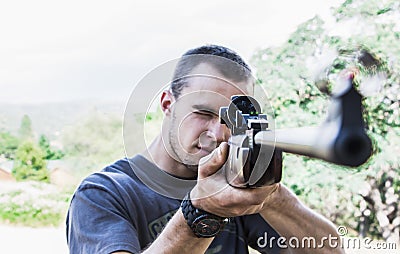 Man with Rifle Stock Photo