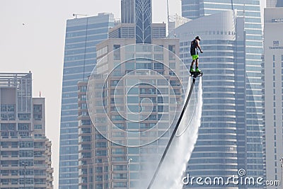 Man rocketing from the water on a flyboard Editorial Stock Photo