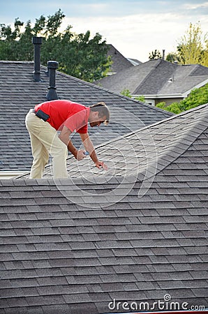 A man on a roof Stock Photo