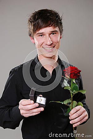 Man with rose and wedding ring Stock Photo