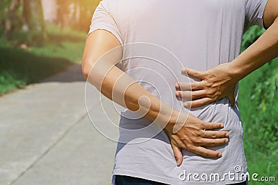 man runing with back pain Stock Photo