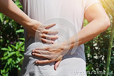 man runing with back pain Stock Photo