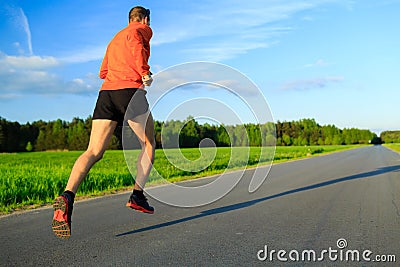 Man running on country road, training inspiration and motivation Stock Photo