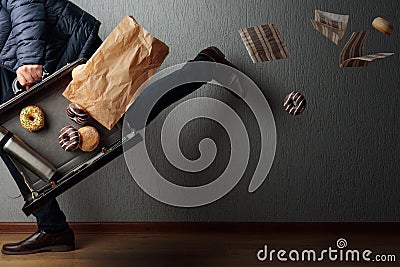 The man runs to the office: he is late and loses the contents of his briefcase Stock Photo