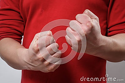 The man`s clenched fists. aggression, domestic or family violence Stock Photo