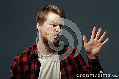 Man`s crazy face crushed on transparent glass Stock Photo