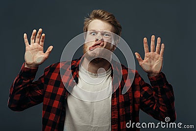 Man`s crazy face crushed on transparent glass Stock Photo