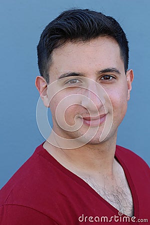 Man`s emotional close portrait with big expressive eyes significant nose, hairy chest and small stubble beard Stock Photo