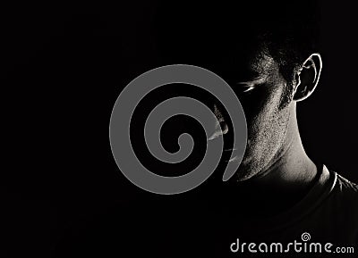 Man's Face in Shadow Stock Photo
