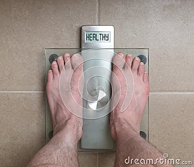 Man`s feet on weight scale - Healthy Stock Photo