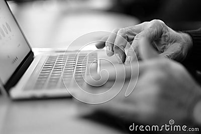 Man`s hand brush on the notebook cursor control button Stock Photo