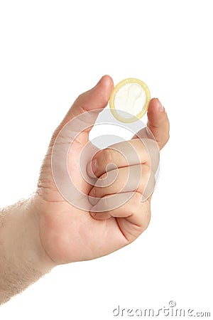 Man's hand with condom Stock Photo