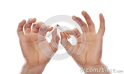 Man's hand crushing cigarette Stock Photo