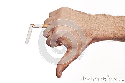 Man's hand crushing cigarette Stock Photo