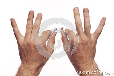 Man's hand crushing cigarettes Stock Photo