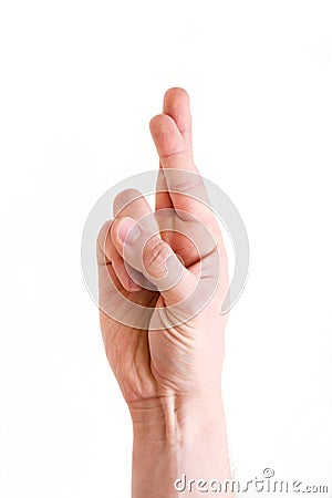 A man`s hand in the gesture `crossed fingers` means success, faith, hope, happiness in achieving the goal Stock Photo