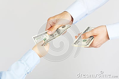 Man's hand give money american hundred dollar bills to boy hand Stock Photo