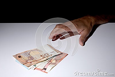 Man`s hand grabbing some Euro banknotes with copy space for your text Stock Photo