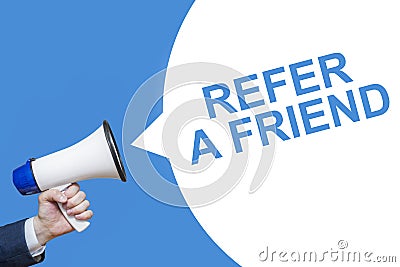 Man`s Hand Holding Megaphone With Speech Bubble REFER A FRIEND. Banner For Business, Announcement, Marketing And Advertising Stock Photo