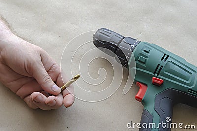 Man`s hand holds a broken drill for metal Stock Photo