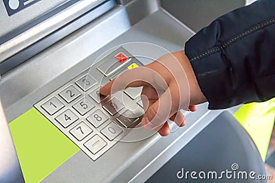 The man`s hand presses the buttons of a keyboard Stock Photo