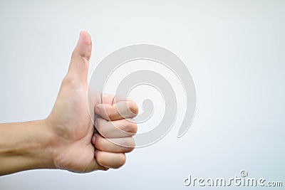 Man`s hand showing is likeable feeling on isolated with clipping path. Stock Photo