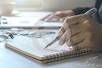 Man`s hand, signature, filling in documents. Stock Photo