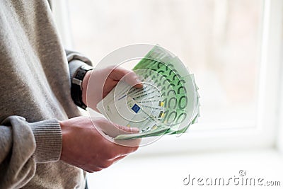 Man`s hands with euro on white background. Financial business concept Stock Photo