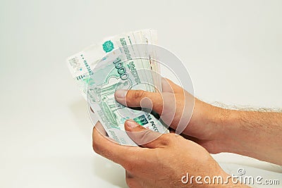 man`s hands are holding Russian money notes Stock Photo