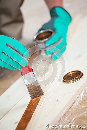 Man's hands painting board Stock Photo