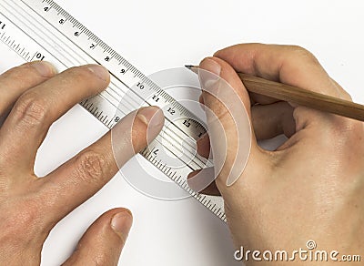 Man's hands are using pen and ruler on the white paper Stock Photo