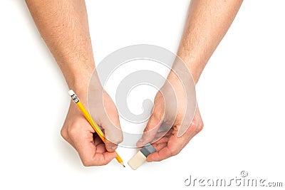 Man`s hands writing with wooden pencil and eracer on isolated white background with text place Stock Photo