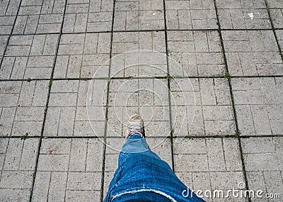 A man`s leg on a tile. Stock Photo