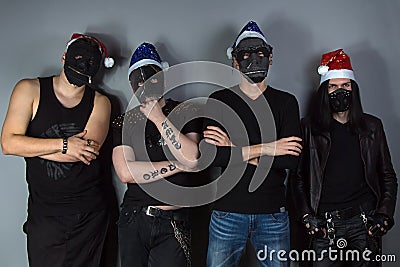 Man's metal band in christmas hats Stock Photo