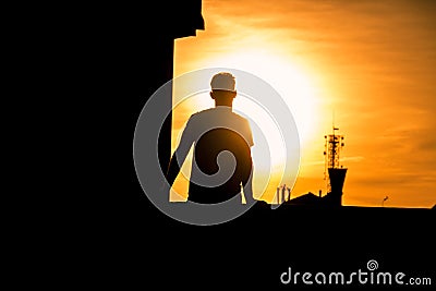 Man`s silhouette in a sunset Stock Photo