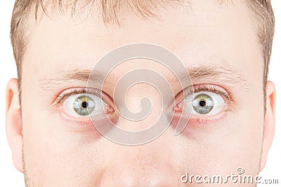 Man's surprised eyes on white Stock Photo