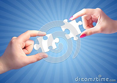 Man's and woman's hands with puzzles Stock Photo