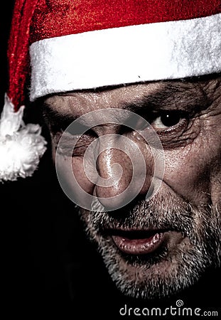 man with a Santa Claus hat in profile shot in the foreground, Christmas is coming. Stock Photo