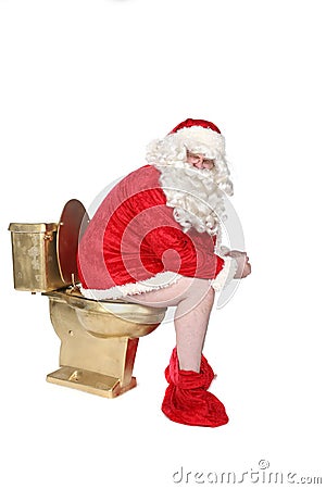 Man in Santa costume sitting on a golden toilet Stock Photo