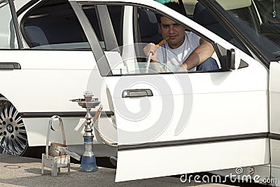 Man sat in his car smoking, Lebanon Editorial Stock Photo