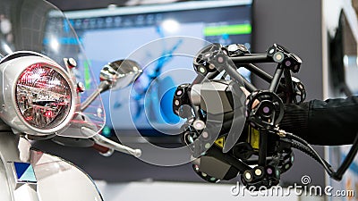 Man scanning a motorcycle using a measuring machine 3D scan high precision Editorial Stock Photo