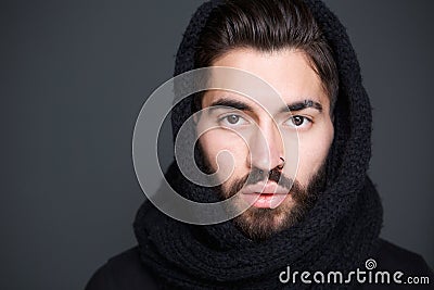 Man with scarf covering head Stock Photo